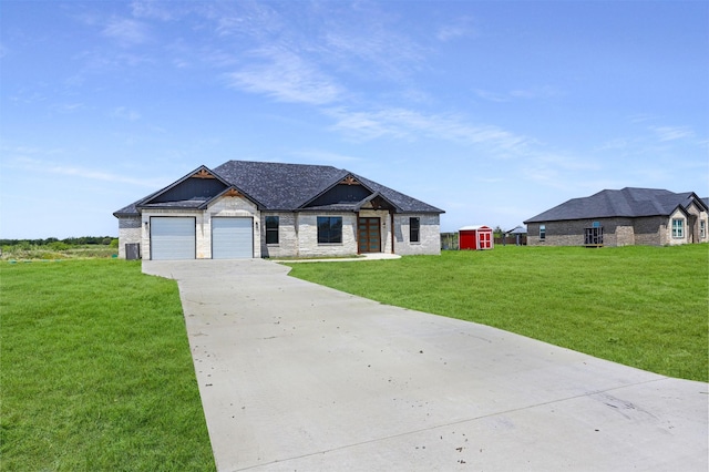 view of front facade with an attached garage, concrete driveway, and a front lawn