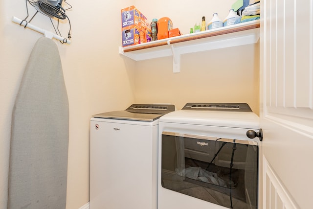 laundry area featuring washing machine and clothes dryer and laundry area