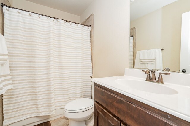 full bathroom featuring toilet and vanity