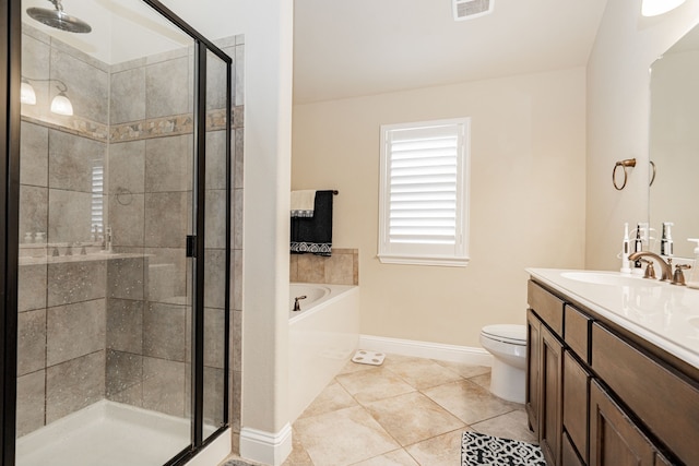 full bath featuring vanity, a shower stall, a garden tub, and visible vents