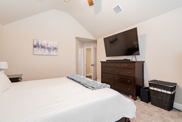 carpeted bedroom featuring visible vents, lofted ceiling, baseboards, and a ceiling fan