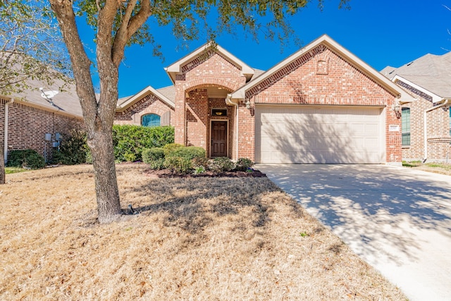 single story home featuring a garage, brick siding, and driveway