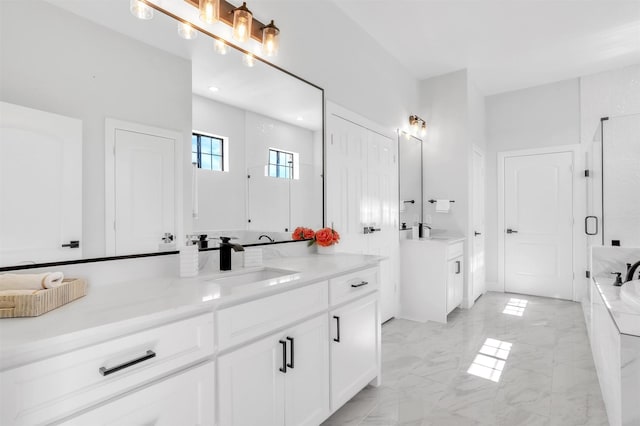 bathroom with marble finish floor, a stall shower, vanity, and a garden tub