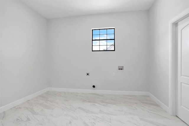 interior space featuring baseboards and marble finish floor