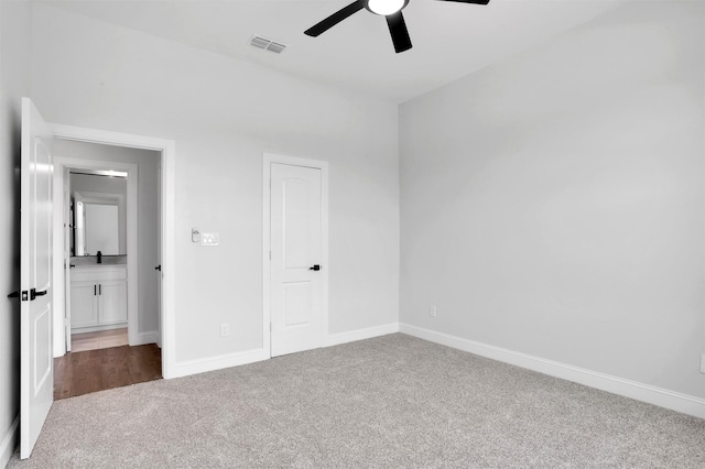 unfurnished bedroom featuring visible vents, carpet floors, baseboards, and a ceiling fan