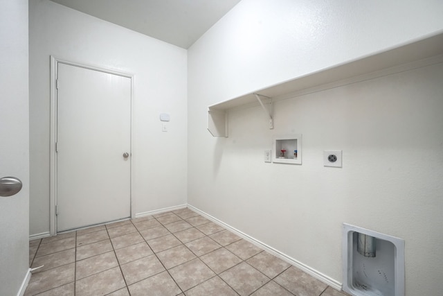 clothes washing area featuring baseboards, washer hookup, laundry area, light tile patterned flooring, and electric dryer hookup