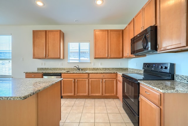 kitchen featuring a sink, black appliances, recessed lighting, and light tile patterned floors