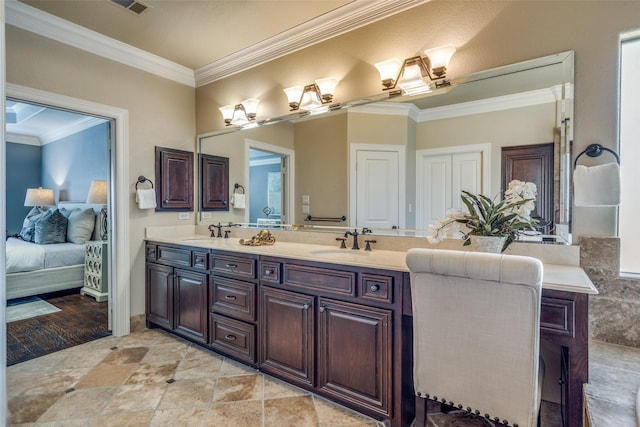 full bathroom with a sink, double vanity, ornamental molding, and connected bathroom