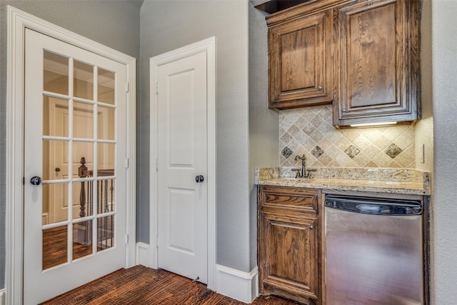 kitchen with tasteful backsplash and light stone counters