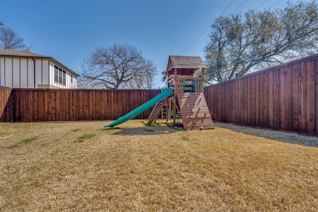 view of play area featuring a yard and a fenced backyard