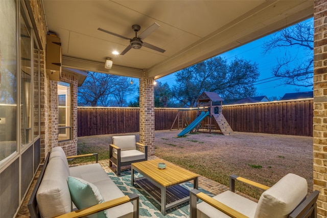 view of patio featuring an outdoor living space, a playground, a fenced backyard, and ceiling fan