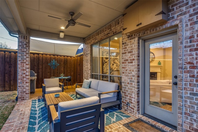 view of patio / terrace with an outdoor living space, area for grilling, ceiling fan, and fence