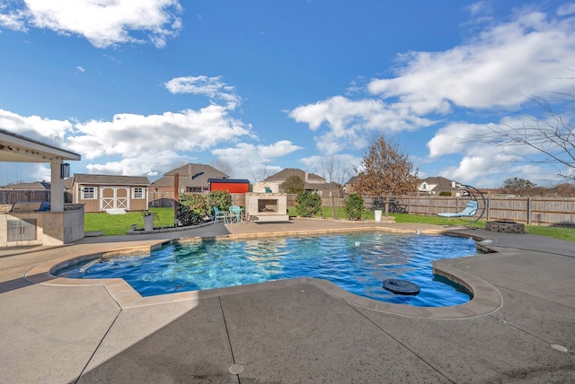 view of pool with a fenced in pool, a residential view, a fenced backyard, an outdoor structure, and a patio