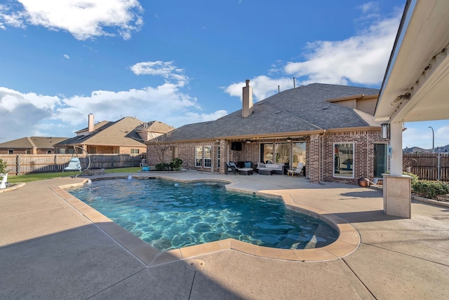 view of pool featuring outdoor lounge area, a patio, a fenced backyard, and a fenced in pool