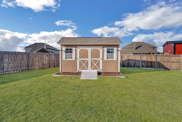 view of shed featuring a fenced backyard