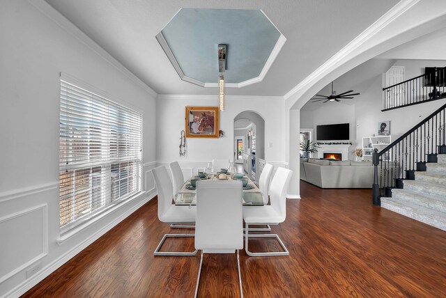 1416 Fence Post Dr, Fort Worth, TX 76052 - living room with high vaulted ceiling, a ceiling fan, stairway, a lit fireplace, and wood finished floors