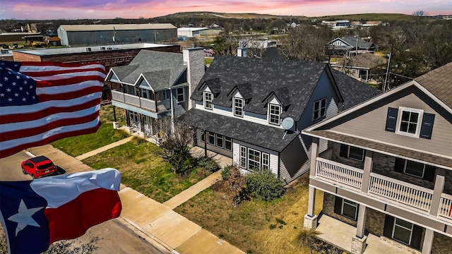 aerial view at dusk with a residential view