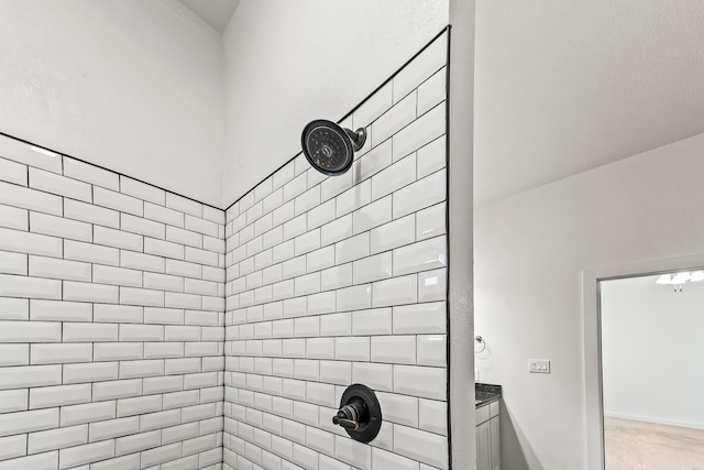 bathroom with tiled shower