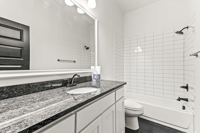 bathroom featuring shower / bathtub combination, toilet, and vanity