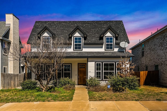 213 E 5th St, Ferris, TX 75125 - view of front of home featuring fence, covered porch, and roof with shingles