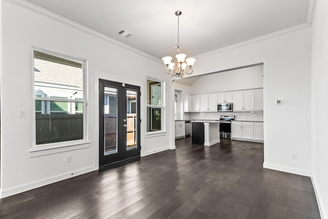 unfurnished dining area with a notable chandelier, visible vents, crown molding, and dark wood-type flooring