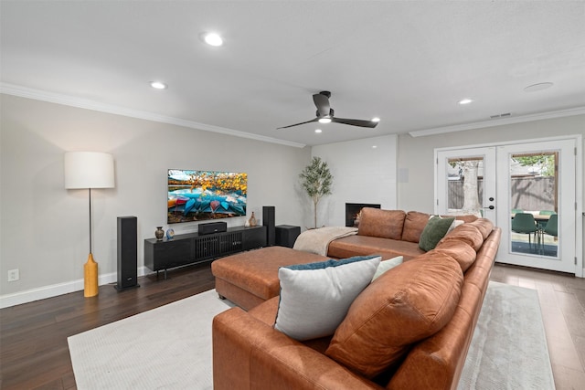 living room featuring french doors, wood finished floors, and ornamental molding