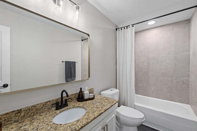 bathroom featuring shower / bath combination with curtain, toilet, and vanity