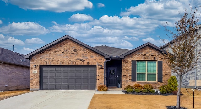 single story home featuring a front yard, a shingled roof, concrete driveway, a garage, and brick siding