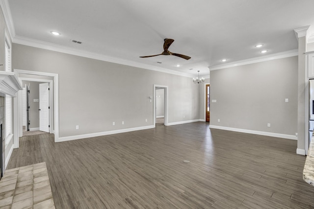 unfurnished living room with visible vents, wood finished floors, a fireplace, and ceiling fan with notable chandelier