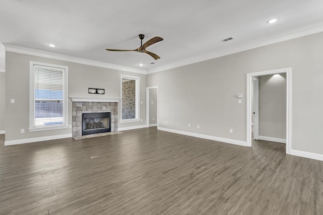 unfurnished living room featuring crown molding, a ceiling fan, and wood finished floors