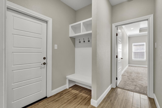 mudroom featuring wood finished floors and baseboards