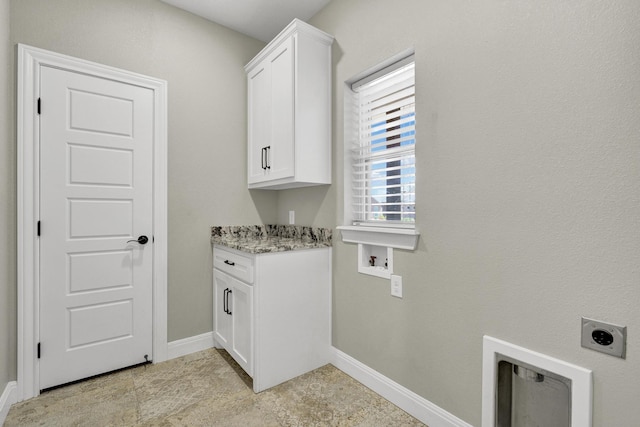 washroom featuring washer hookup, cabinet space, baseboards, and hookup for an electric dryer