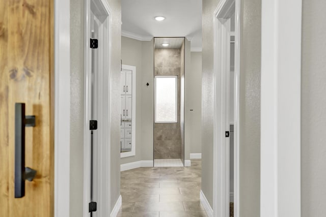 hall featuring recessed lighting, baseboards, and ornamental molding