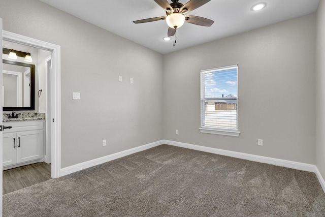 unfurnished bedroom with ceiling fan, baseboards, carpet floors, recessed lighting, and ensuite bath