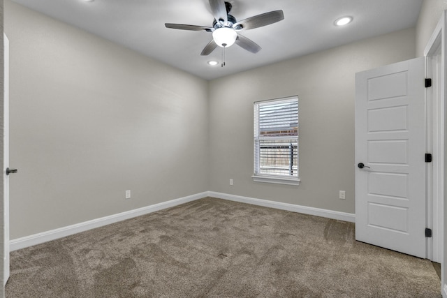 carpeted spare room featuring recessed lighting, baseboards, and ceiling fan