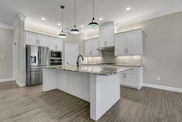 kitchen with backsplash, stone counters, appliances with stainless steel finishes, light wood-style floors, and a sink