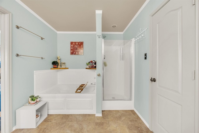 bathroom featuring a shower stall, crown molding, and a garden tub