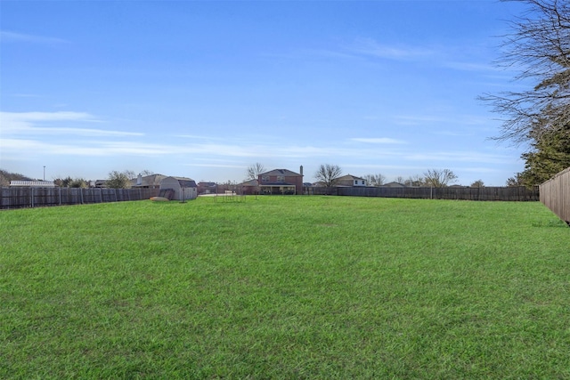 view of yard with a fenced backyard