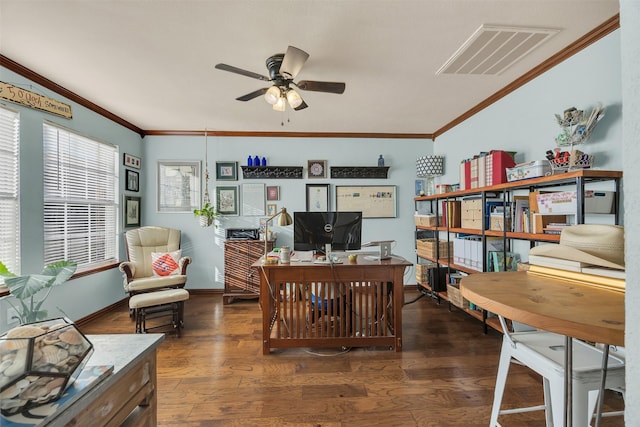 office space with visible vents, dark wood-style floors, ornamental molding, and a ceiling fan