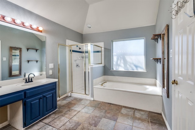 full bathroom featuring vanity, lofted ceiling, a garden tub, and a shower stall