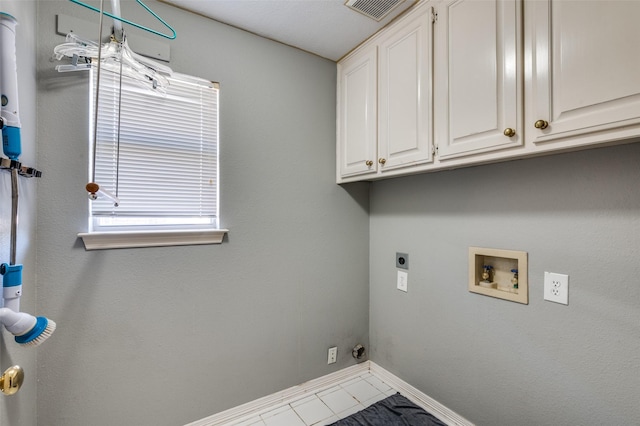 washroom with visible vents, baseboards, hookup for a washing machine, cabinet space, and electric dryer hookup