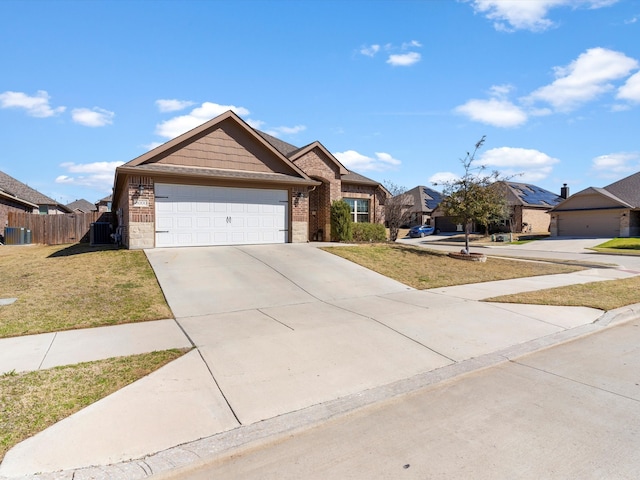 single story home featuring a front lawn, a garage, fence, and brick siding