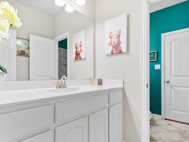 full bath featuring baseboards, toilet, and vanity