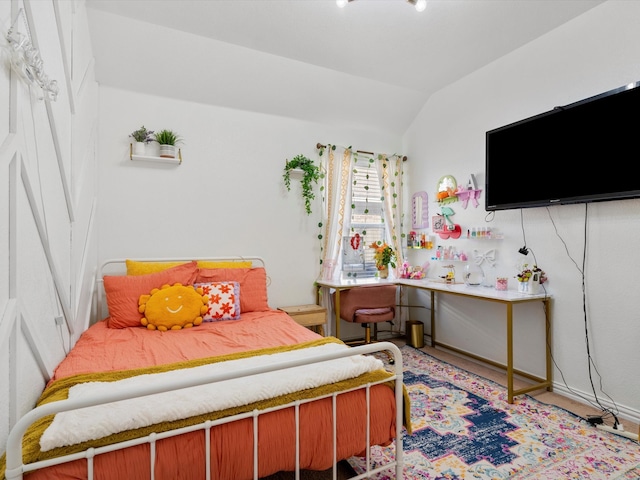 bedroom with vaulted ceiling