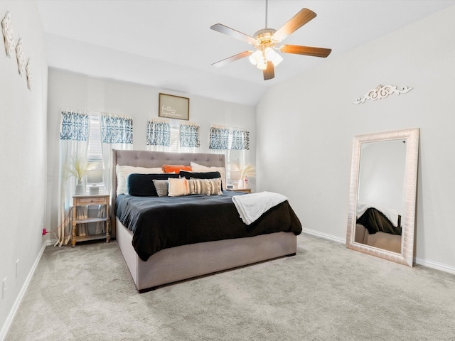 bedroom with baseboards, a ceiling fan, lofted ceiling, and carpet floors