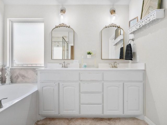 full bath featuring a sink, an enclosed shower, a garden tub, and double vanity