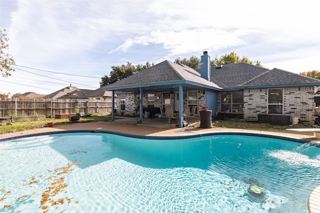 view of pool with a fenced in pool, a patio, and fence