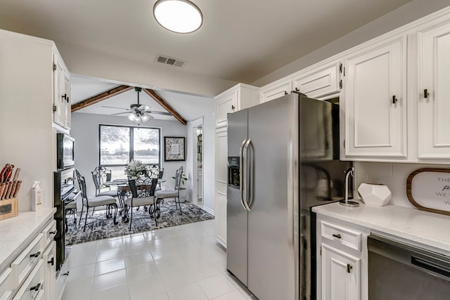 kitchen featuring visible vents, white cabinetry, stainless steel fridge with ice dispenser, dishwasher, and black oven