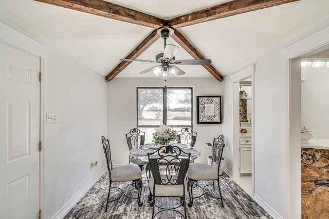 dining room featuring vaulted ceiling with beams, baseboards, and ceiling fan