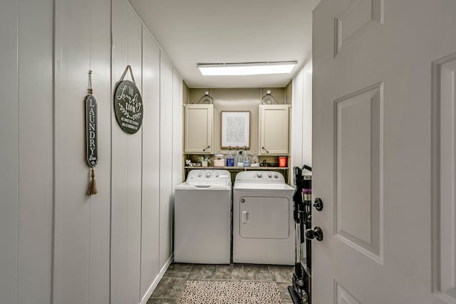 washroom with cabinet space and independent washer and dryer